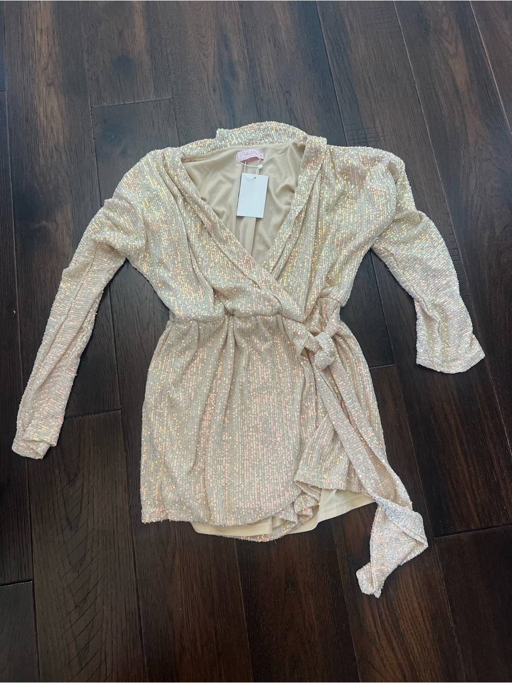 Something to believe in Sequin Wrap Romper in Champagne